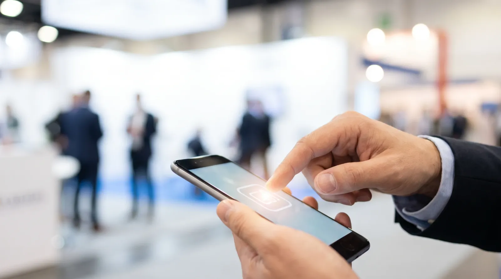 Tapping a button on a smartphone right after a booth conversation